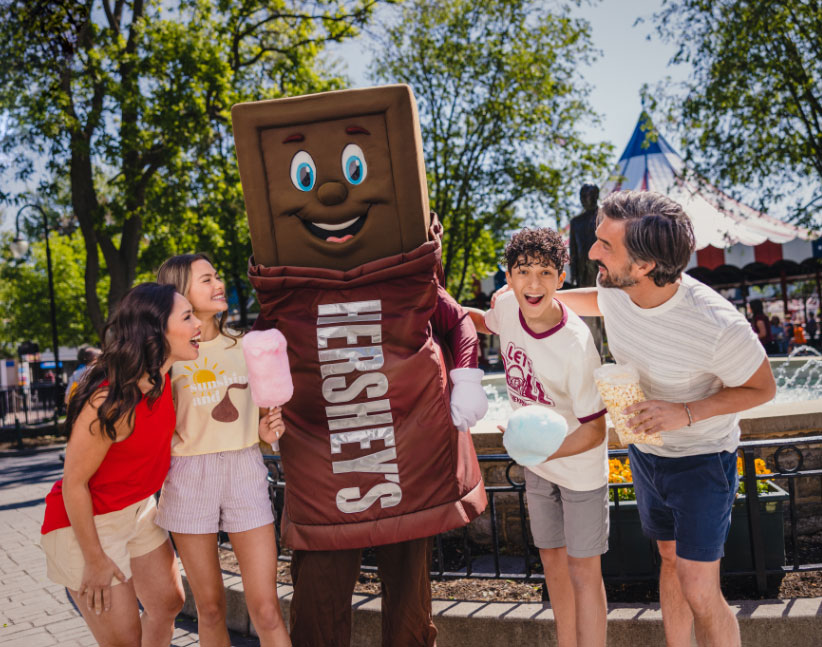 Father and kids posing with Hershey Bar