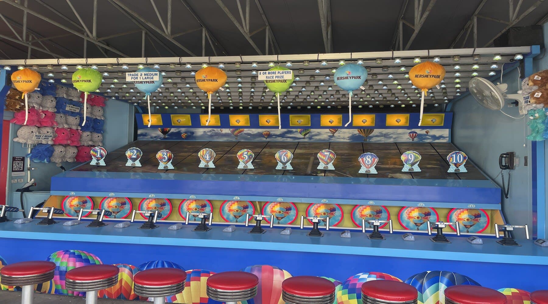Race against others by shooting water at a target