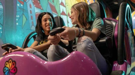 Two girls on Laff Trakk