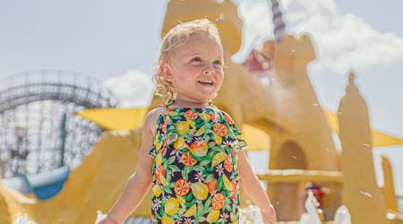 Little girl stranding in front of Sandcastle Cove