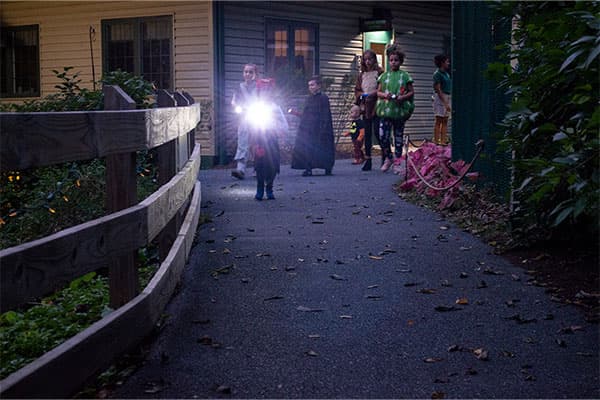 kids walking with flashlight halloween zoo hersheypark