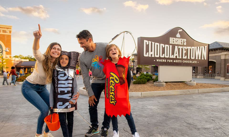 family at chocolatetown mom pointing toward fun