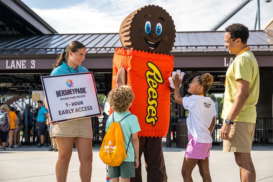 family with hersheypark character and employee