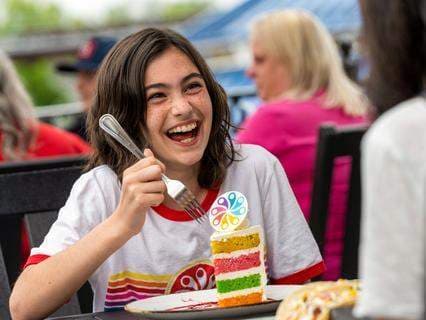 girl eating cake at chocolatier