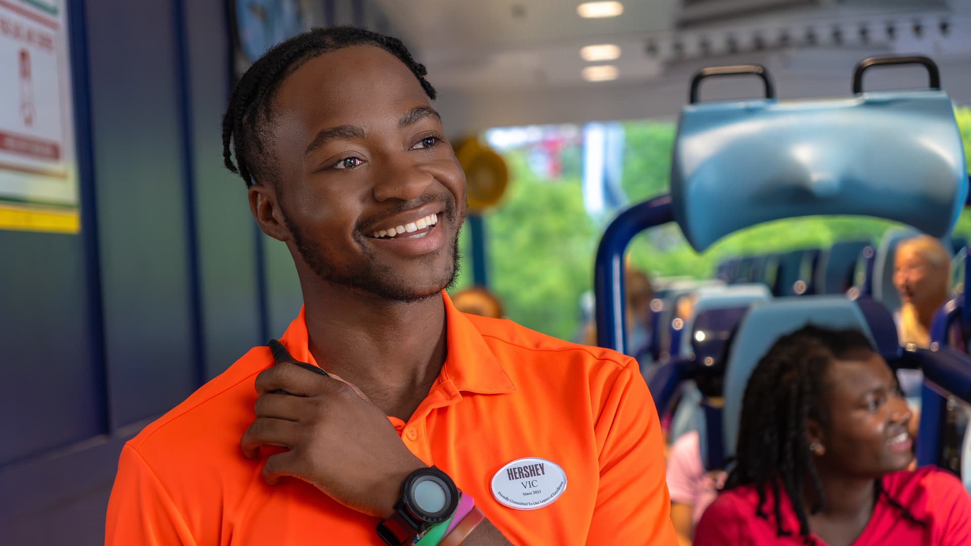 hersheypark-employee-smiling-while-on-walkie-talkie.jpg