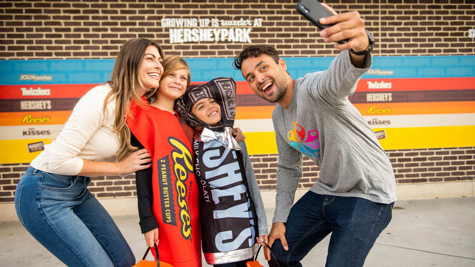 family taking selfies during hersheypark halloween