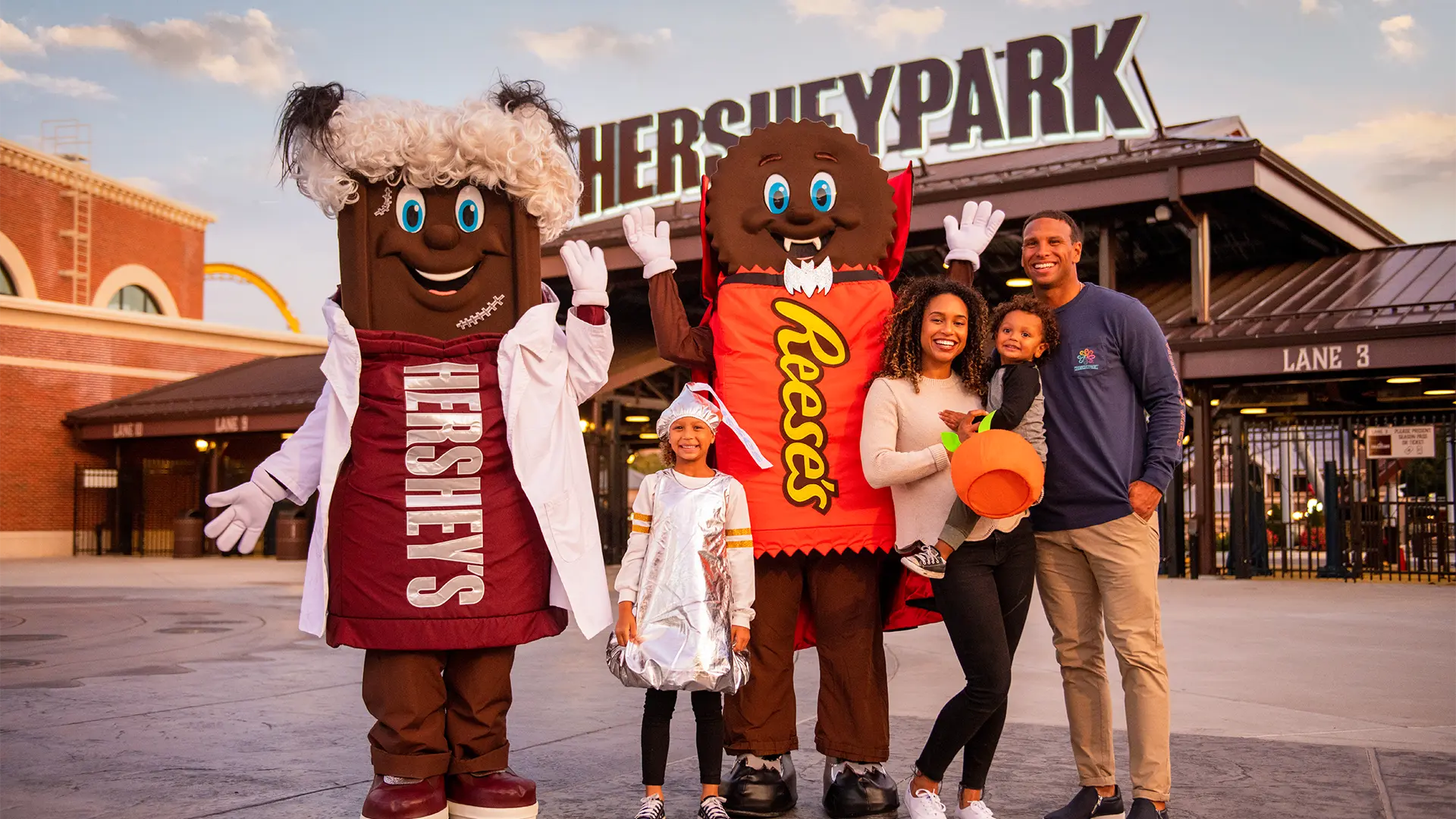 Family In Costumes At Front Gates Hersheypark Halloween