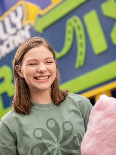 girl eating cotton candy