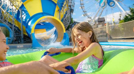 girls riding Coastline Plunge Whirlwind water attraction at Hersheypark