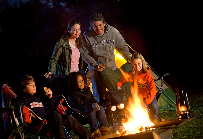 Family around a campfire