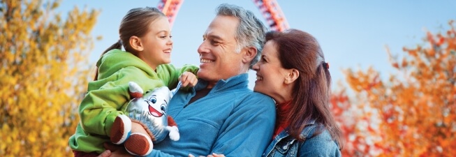 Family enjoying Hersheypark in front of Fahrenheit roller coaster